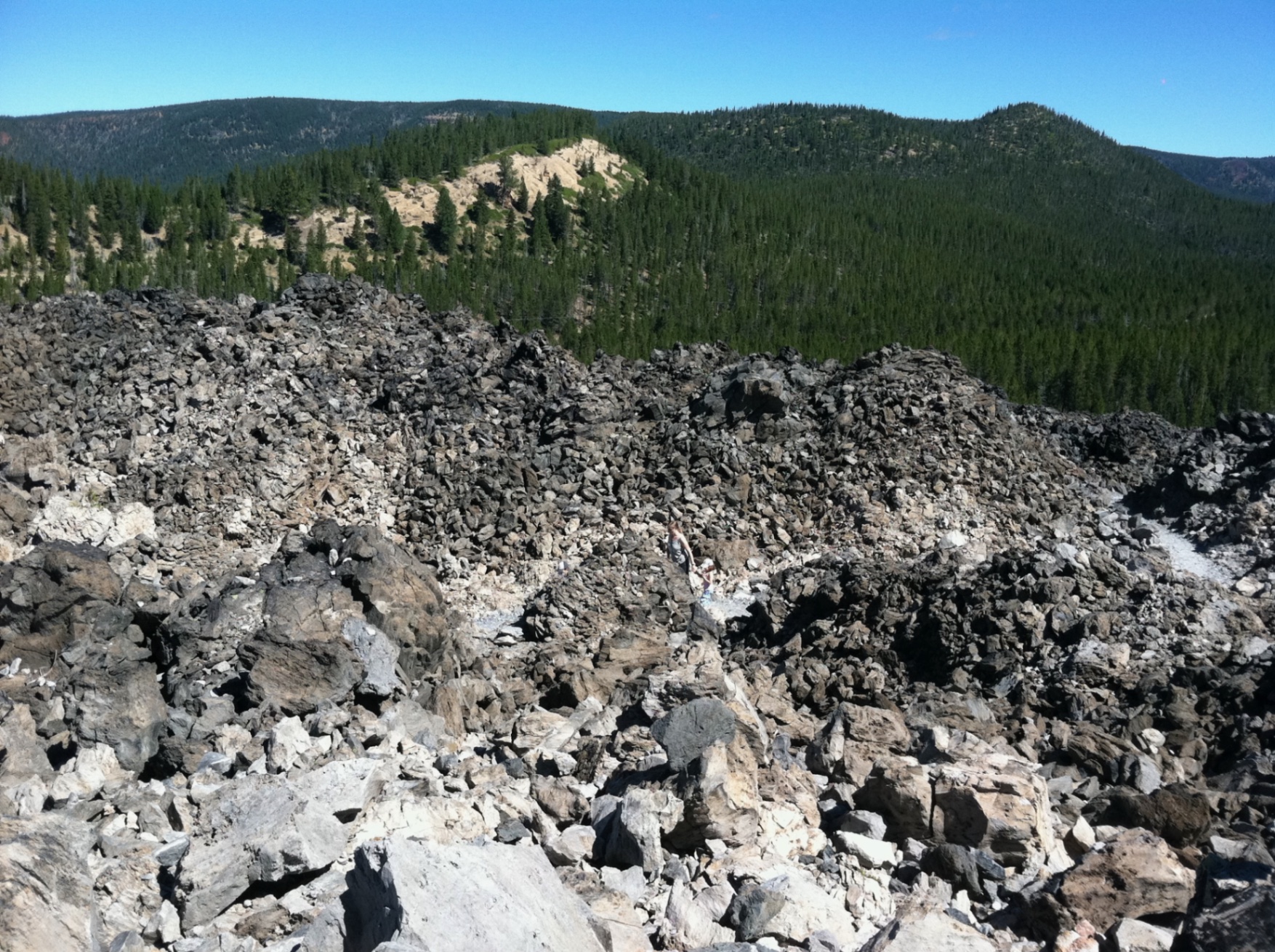 I love the lunar like landscape of this massive lava flow. The Big Obsidian Flow is, stark and beautiful like a roiling ocean, frozen mid-churn.